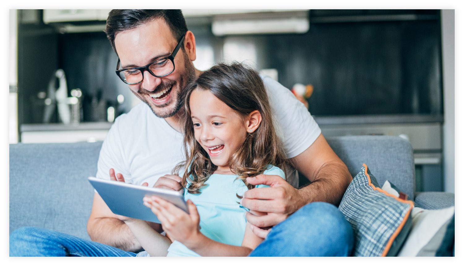 Father and daughter using tablet